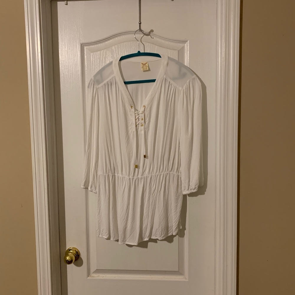 White shirt, gold accessories